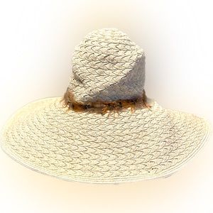 White white gold straw floppy hat with brown feathers and tassel